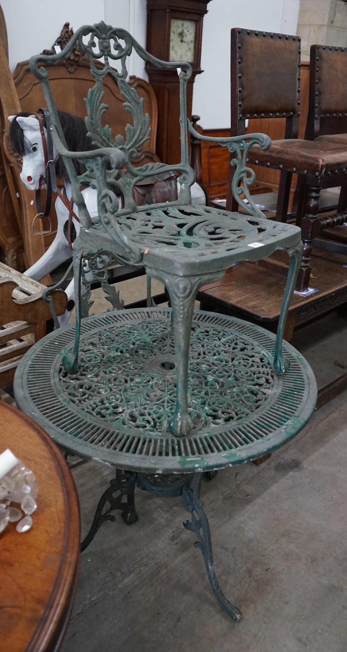 A painted aluminium circular garden table and two chairs, width 80cm, height 69cm